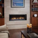 A darkly lit living room with a central fireplace as the focal point