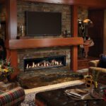 A fireplace in a rustic looking living room
