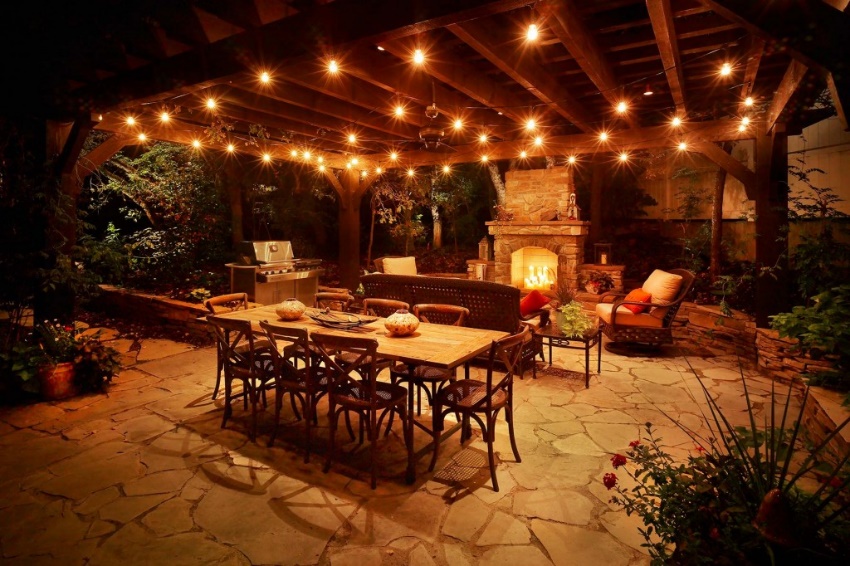 night photograph of outdoor kitchen and patio