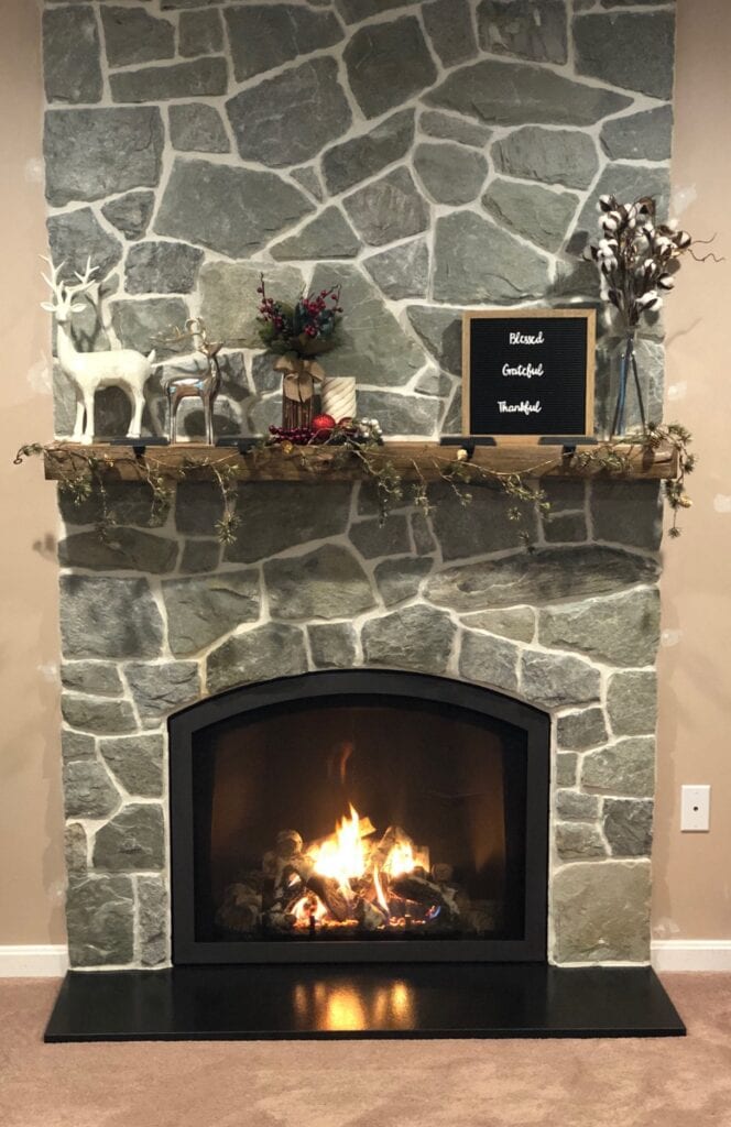 family room fireplace decorated for Christmas