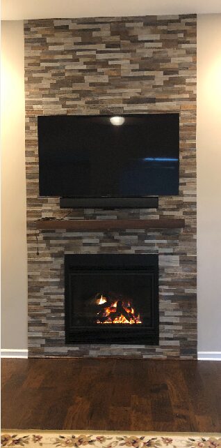 Television mounted above fireplace
