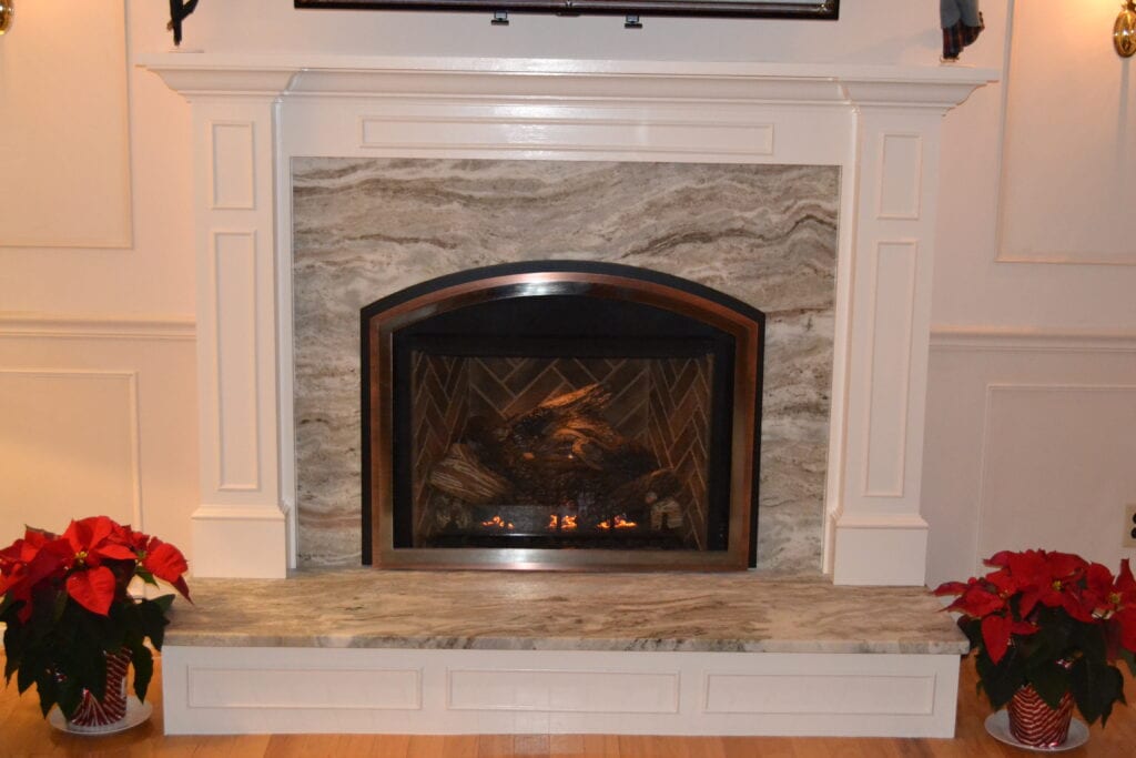 stone wall fireplace with white moulding