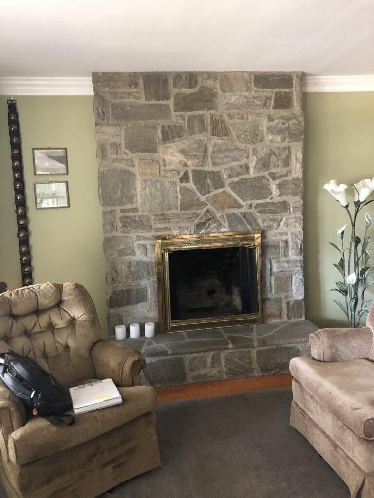 recliner in front of fireplace