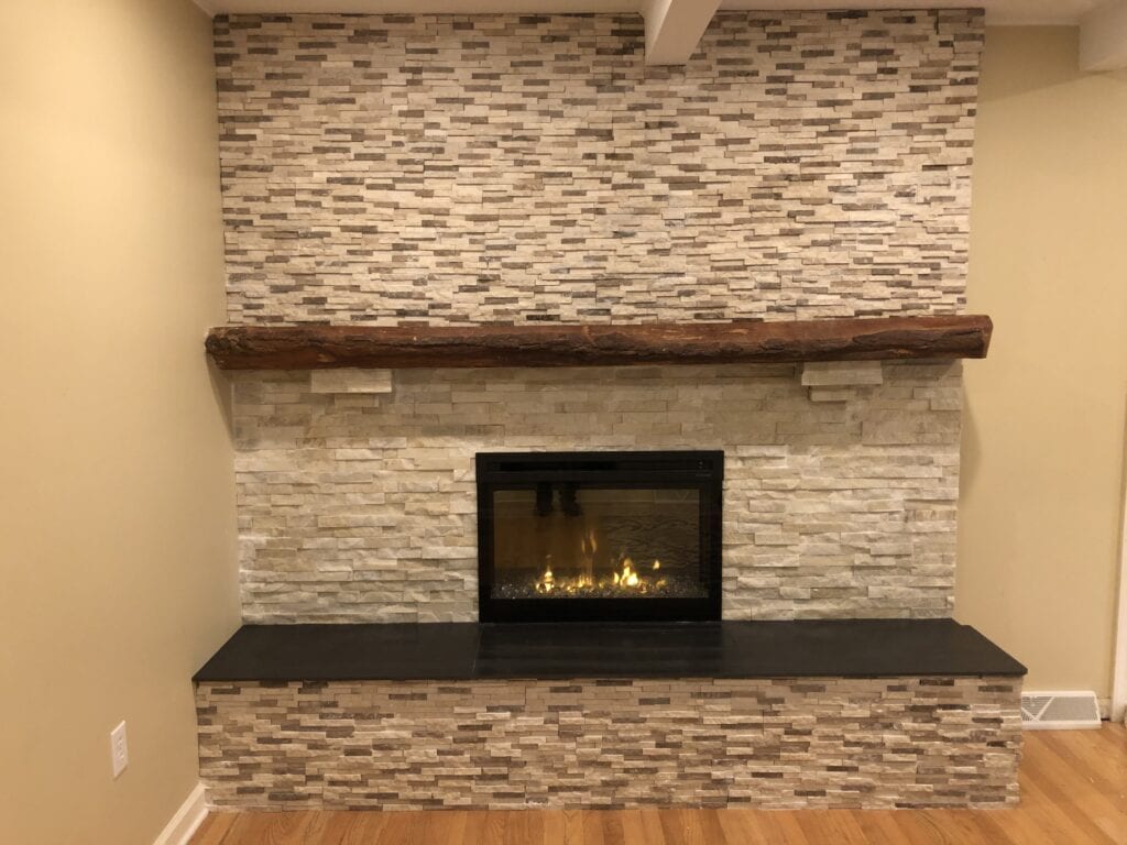 gas fireplace with stone chimney