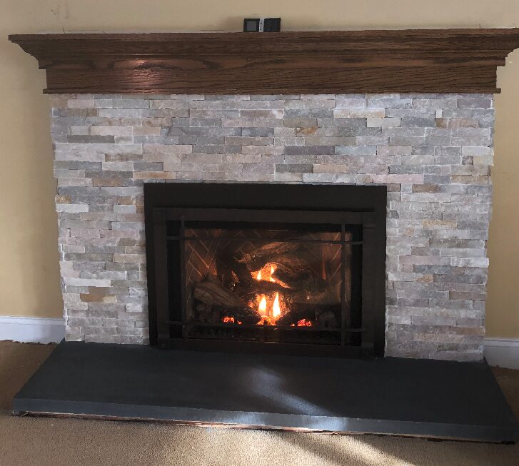 fireplace with wooden mantel