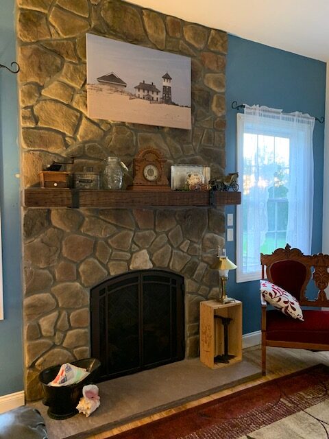 fireplace with hanging picture