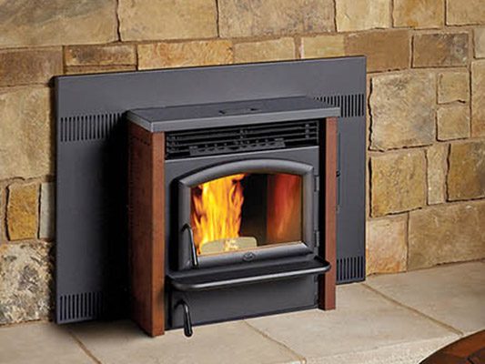 pellet stove against stone wall
