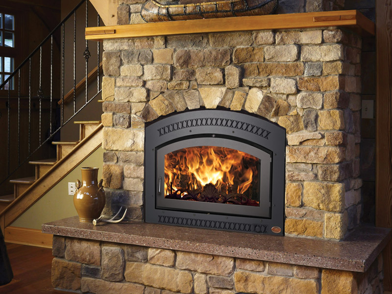 a cozy fireplace with a stone border