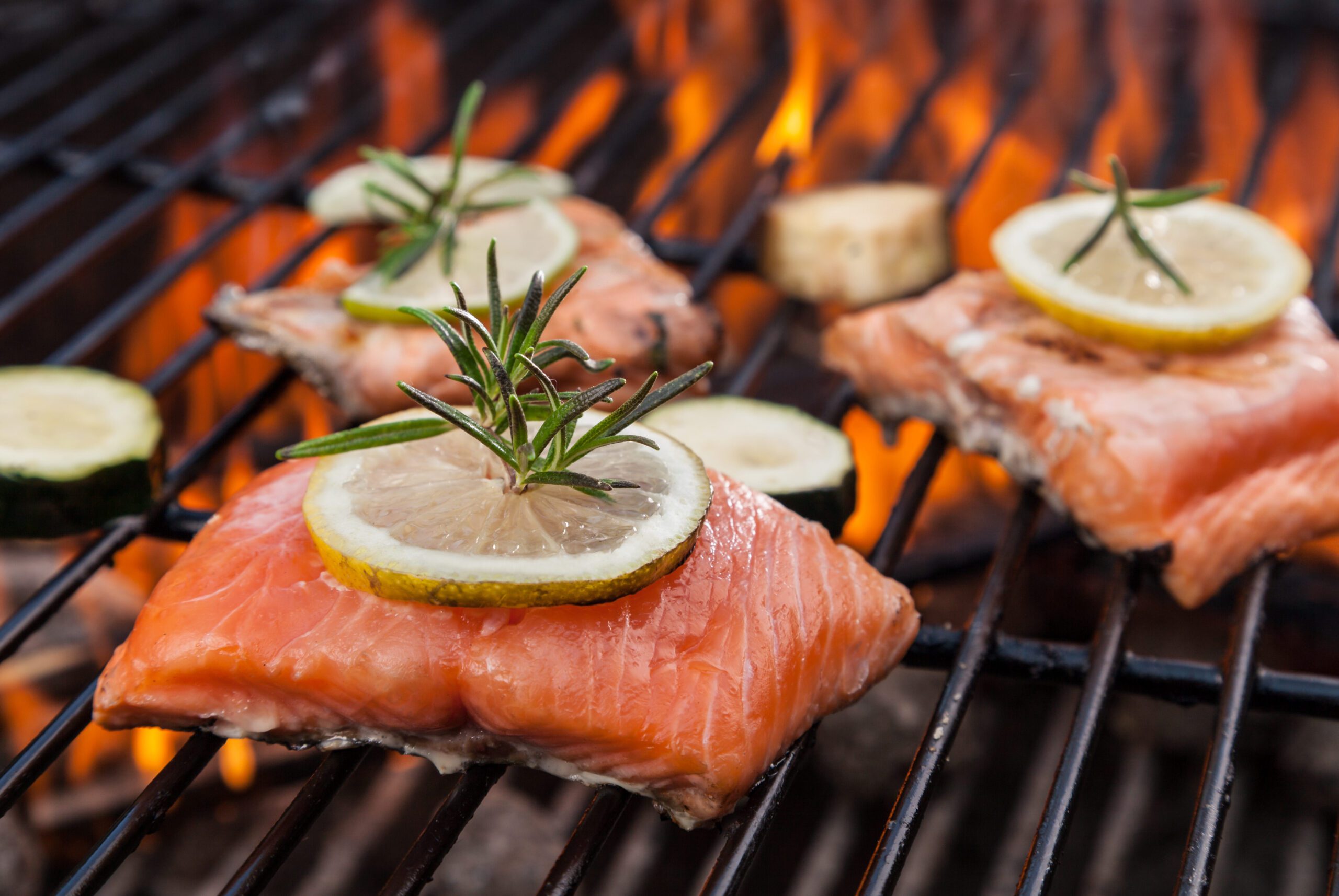 salmon grilling over a fire
